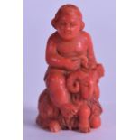 A 19TH CENTURY EUROPEAN CARVED CORAL FIGURE OF A MALE modelled riding upon a ram. 36 grams. 5 cm