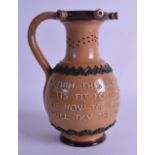 A 19TH CENTURY DOULTON LAMBETH PUZZLE JUG decorated with motifs and a motto. 23 cm high.