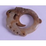 A SMALL CHINESE CARVED MUTTON JADE CIRCULAR FLAT FIGURE in the form of a coiled dragon, with incised