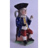 AN UNUSUAL MID 19TH CENTURY STAFFORDSHIRE FIGURAL JUG modelled as a male holding a jug of ale and