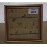 A SMALL 19TH CENTURY FRAMED SAMPLER. 12 cm square.