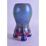 A STYLISH EURUOPEAN IRIDESCENT GLASS VASE upon three scrolling feet. 17.5 cm high.