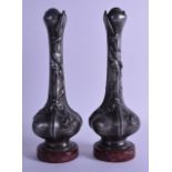 A PAIR OF ART NOUVEAU FRENCH SPELTER VASES of scrolling organic rom, upon marble bases. Signed. 31.5