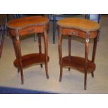 A PAIR OF EARLY 20TH CENTURY FRENCH KIDNEY SHAPED SIDE CABINETS with brass mounts. 66 cm x 42 cm.