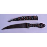 AN UNUSUAL 19TH CENTURY MIDDLE EASTERN KNIFE inset with turquoise and coral. 24 cm long.