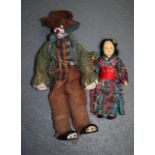 A CLOWN DOLL together with an Oriental figure. (2)