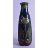 AN AUSTRIAN ART NOUVEAU POTTERY VASE decorated with stylised flowers. 30 cm high.