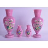 A PAIR OF VICTORIAN/EDWARDIAN PINK OPALINE GLASS VASES painted with flowers, together with a smaller