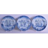 A GROUP OF THREE 18TH/19TH CENTURY CONTINENTAL BLUE AND WHITE FAIENCE PLATES painted with figures in