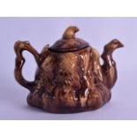 A 19TH CENTURY TREACLE GLAZED TEAPOT AND COVER of naturalistic form, the base inscribed Miss Sarah