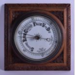 A LATE VICTORIAN/EDWARDIAN OAK CASED ANEROID BAROMETER. 28 cm square.