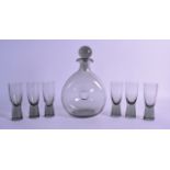 A HOLMEGAARD DECANTER AND STOPPER with six matching Canada glasses. 24 cm & 11.5 cm high. (7)