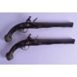 A PAIR OF 18TH/19TH CENTURY CONTINENTAL PISTOLS silver and brass inlaid with motifs and star