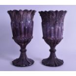 A PAIR OF LATE VICTORIAN PRESSED GLASS PEDESTAL GOBLETS imitating agate, upon a floral incised foot.