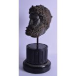 A 19TH CENTURY CARVED PLASTER GRAND TOUR BUST After the Antique, imitating bronze. Head 18 cm