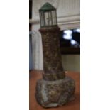 A VINTAGE CARVED SERPENTINE LIGHTHOUSE LAMP. 28 cm high.