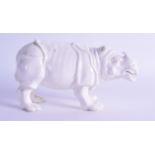 A 19TH CENTURY CHINESE BLANC DE CHINE PORCELAIN FIGURE OF A RHINOCEROS. 20 cm wide.