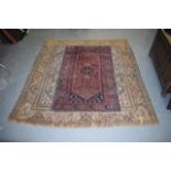 TWO EASTERN RUGS one decorated with flowers upon a blue ground. (2)