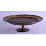 A 19TH CENTURY CONTINENTAL COPPER AND BRASS TAZZA decorated in relief with fowl pecking within a