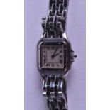 A LADIES STAINLESS STEEL CARTIER WRISTWATCH with sapphire cabochon winder. 2.75 cm wide.