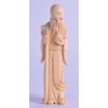 A 19TH CENTURY CHINESE CARVED IVORY FIGURE OF SAGE modelled holding a peach and staff. 10.5 cm