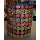 AN UNUSUAL VINTAGE CYLINDRICAL BASKET formed from coca cola bottle caps.