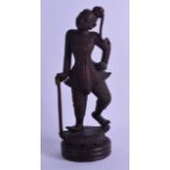 A LATE 19TH CENTURY EASTERN CARVED WOOD FIGURE OF A STANDING FEMALE modelled upon a circular base.