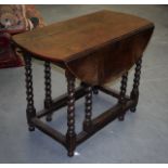 AN 18TH CENTURY COUNTRY OAK DROP FLAP TABLE with barley twist supports. 98 cm x 73 cm extended.