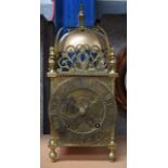 A VICTORIAN BRASS LANTERN CLOCK in the 17th century style, engraved with flowers. 36 cm x 15 cm.