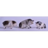 A LOVELY SET OF THREE 19TH CENTURY GERMAN PORCELAIN FIGURES OF PIGS each modelled in a different