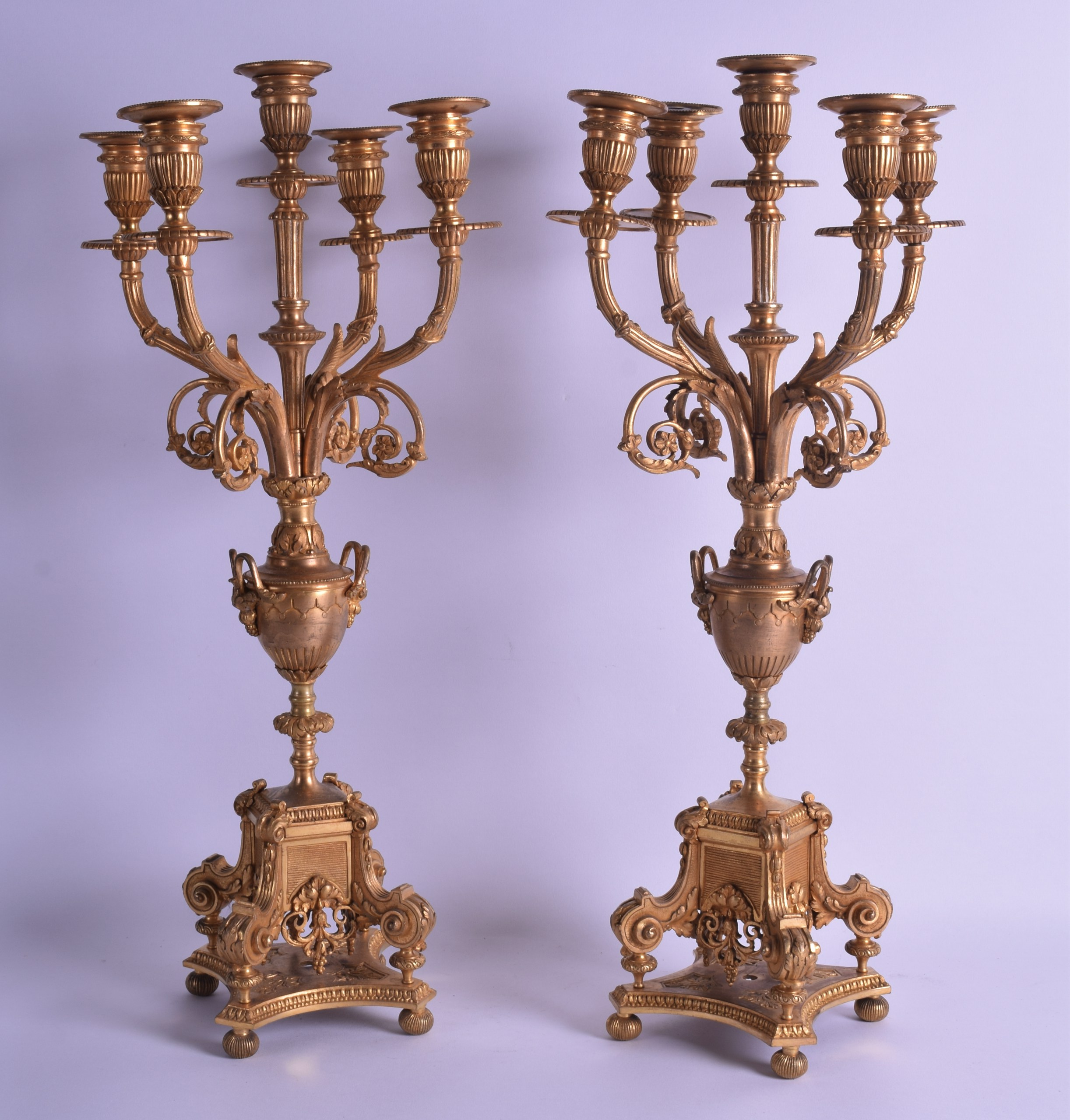 A PAIR OF LATE 19TH CENTURY FRENCH ORMOLU FIVE BRANCH CANDLEABRA modelled with scrolling acanthus