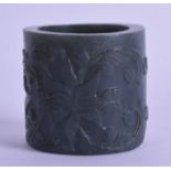 A 19TH CENTURY TURKISH OTTOMAN CARVED JADE CYLINDRICAL RING decorated with flowers. 5 cm x 5.25 cm.