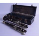 AN EARLY 20TH CENTURY CASED CLARINET by Karl Meyer. 70 cm long.