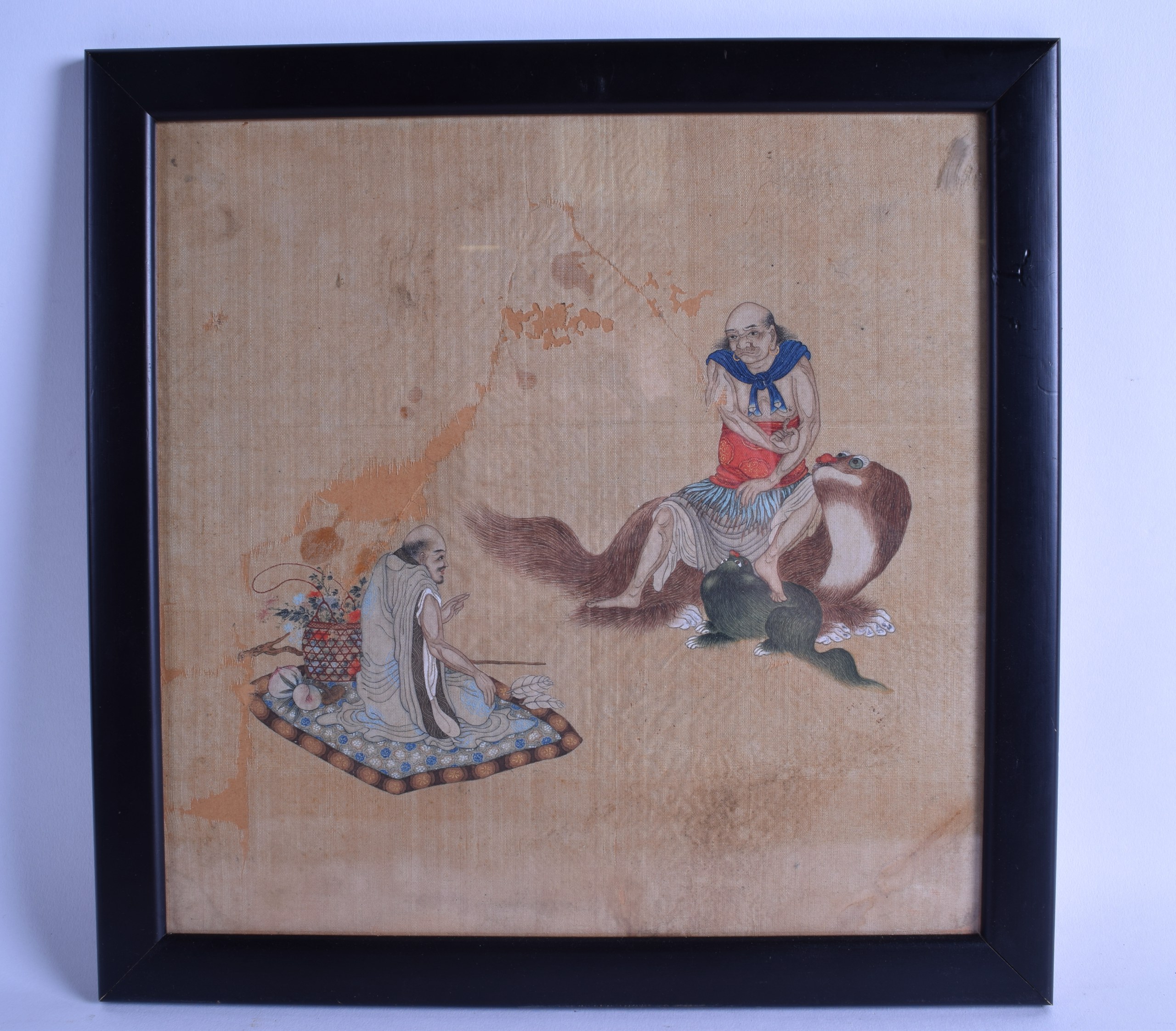 A MID 19TH CENTURY CHINESE FRAMED WATERCOLOUR depicting a male sitting upon a buddhistic beast,