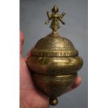 AN UNUSUAL INDIAN ENGRAVED BRASS VESSEL AND COVER.