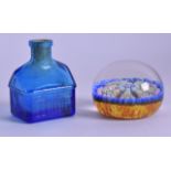A VINTAGE GLASS PAPERWEIGHT together with a glass bottle in the shape of a house. Paperweight 5.25