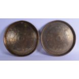 A PAIR OF EARLY 20TH CENTURY INDIAN ENGRAVED BRASS DISHES decorated with figures, horses and