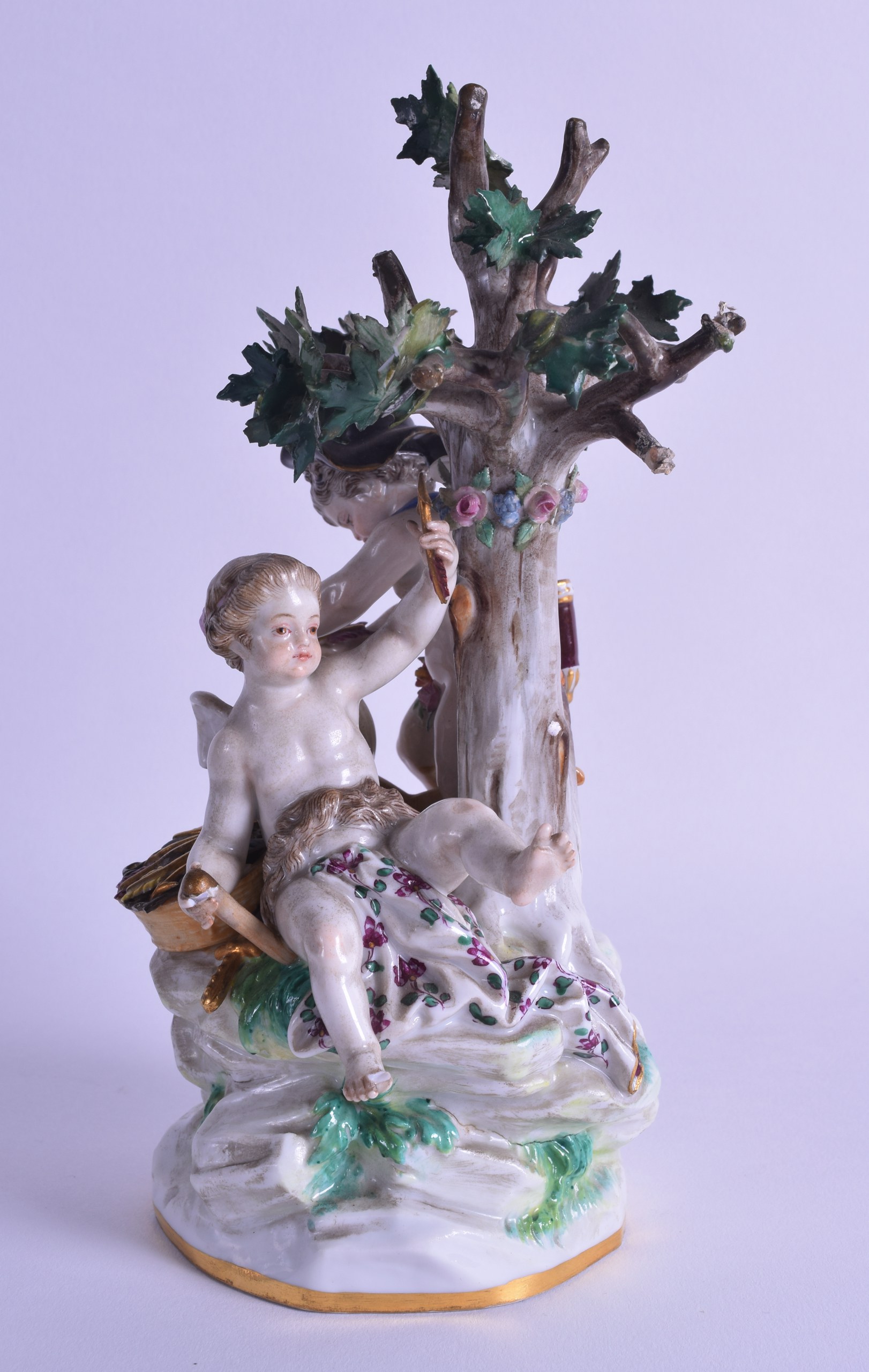 A 19TH CENTURY MEISSEN PORCELAIN FIGURE OF A KNIFE GRINDER modelled beside a putti, upon a - Image 2 of 3