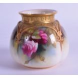 A ROYAL WORCESTER PORCELAIN VASE of square form, painted with roses under a raised gilt border. 7.