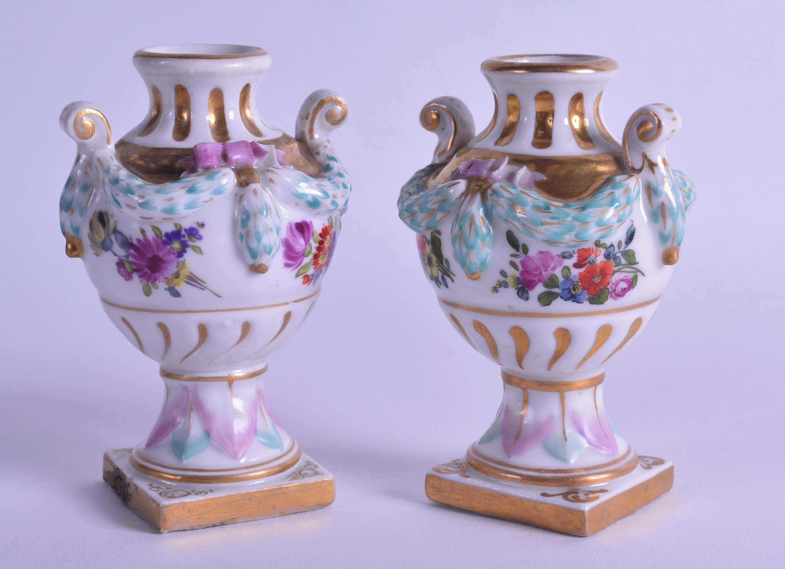 A PAIR OF LATE 19TH CENTURY MEISSEN STYLE PORCELAIN VASES painted with flowers, overlaid with blue