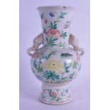 A MID 19TH CENTURY CHINESE TWIN HANDLED FAMILLE ROSE VASE bearing Qianlong marks to base, painted