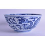 A 19TH CENTURY CHINESE BLUE AND WHITE PORCELAIN BOWL Kangxi style, painted with dragons and foliage.