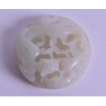 A CHINESE CARVED WHITE JADE BI DISC overlaid with a clambering chilong dragon. 5 cm diameter.