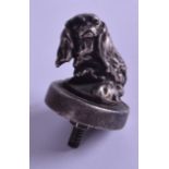 AN ANTIQUE SILVER SPANIEL DOG CAR HOOD ORNAMENT signed. 7 cm x 9 cm.