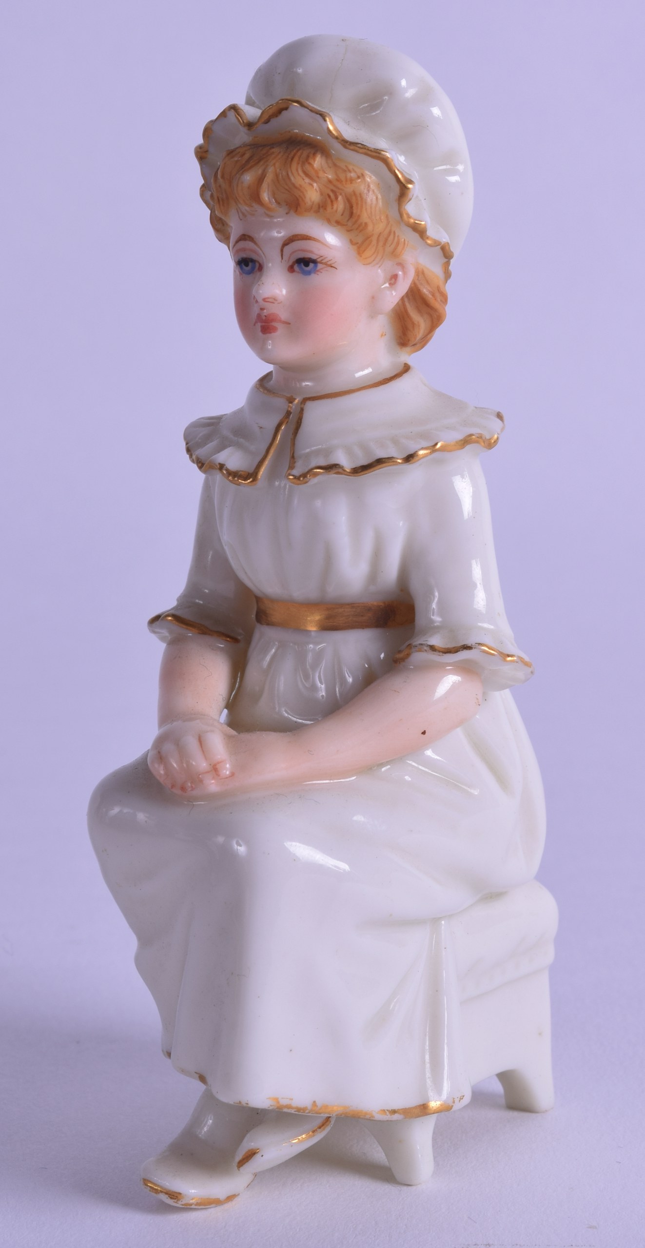 Royal Worcester uncommon Kate Greenaway figure of a girl seated on a stool with her hands in her