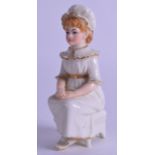 Royal Worcester uncommon Kate Greenaway figure of a girl seated on a stool with her hands in her