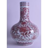 A CHINESE IRON RED PORCELAIN BULBOUS VASE bearing Qianlong marks to base, painted with floral sprays