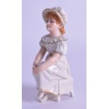 Royal Worcester uncommon Kate Greenaway figure of a girl seated on a stool with her hands in her