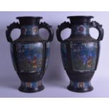 A PAIR OF 19TH CENTURY CHINESE TWIN HANDLED BRONZE VASES decorated with figures and horses within