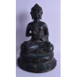 A SOUTH EAST ASIAN BRONZE FIGURE OF A BUDDHA modelled upon a lotus base. 36.5 cm high.